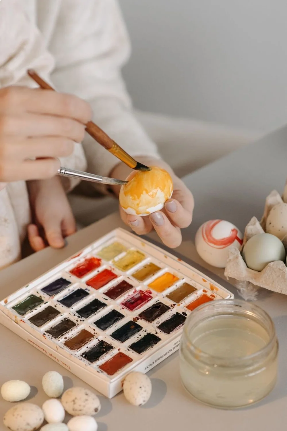 Watercolor wash nail design with translucent colors blending in irregular patches for back to school nails