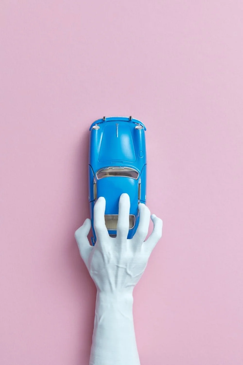 Flat lay of nine navy beach nails and one white nail with coral starfish detail