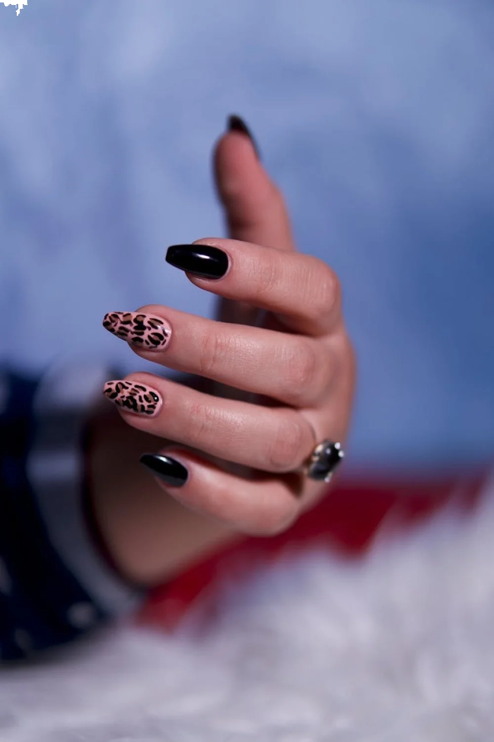 Close-up of stiletto nails showing the sharp point and tapering angle, with lighting that emphasizes the dramatic shape