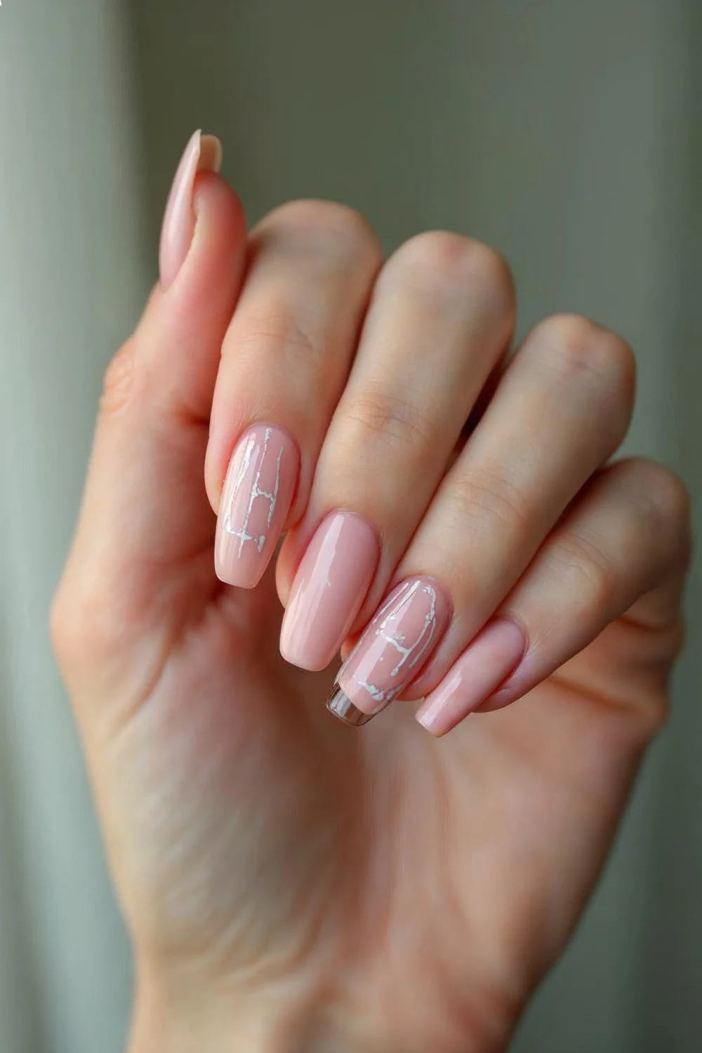 Close-up of hand showing negative space design with clean geometric lines and natural nail showing through
