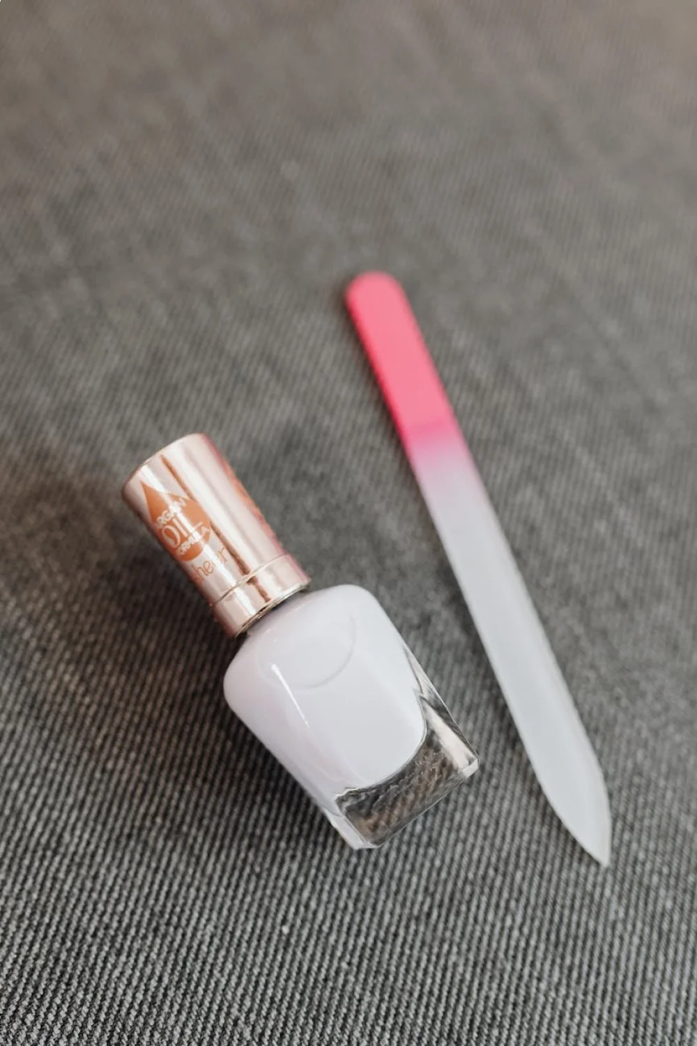 Flat lay of all French manicure tools and products arranged on white background