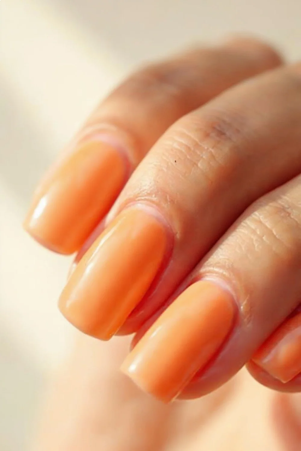 Cantaloupe cream manicure with translucent finish on short square nails, ideal for summer nail colors 2026