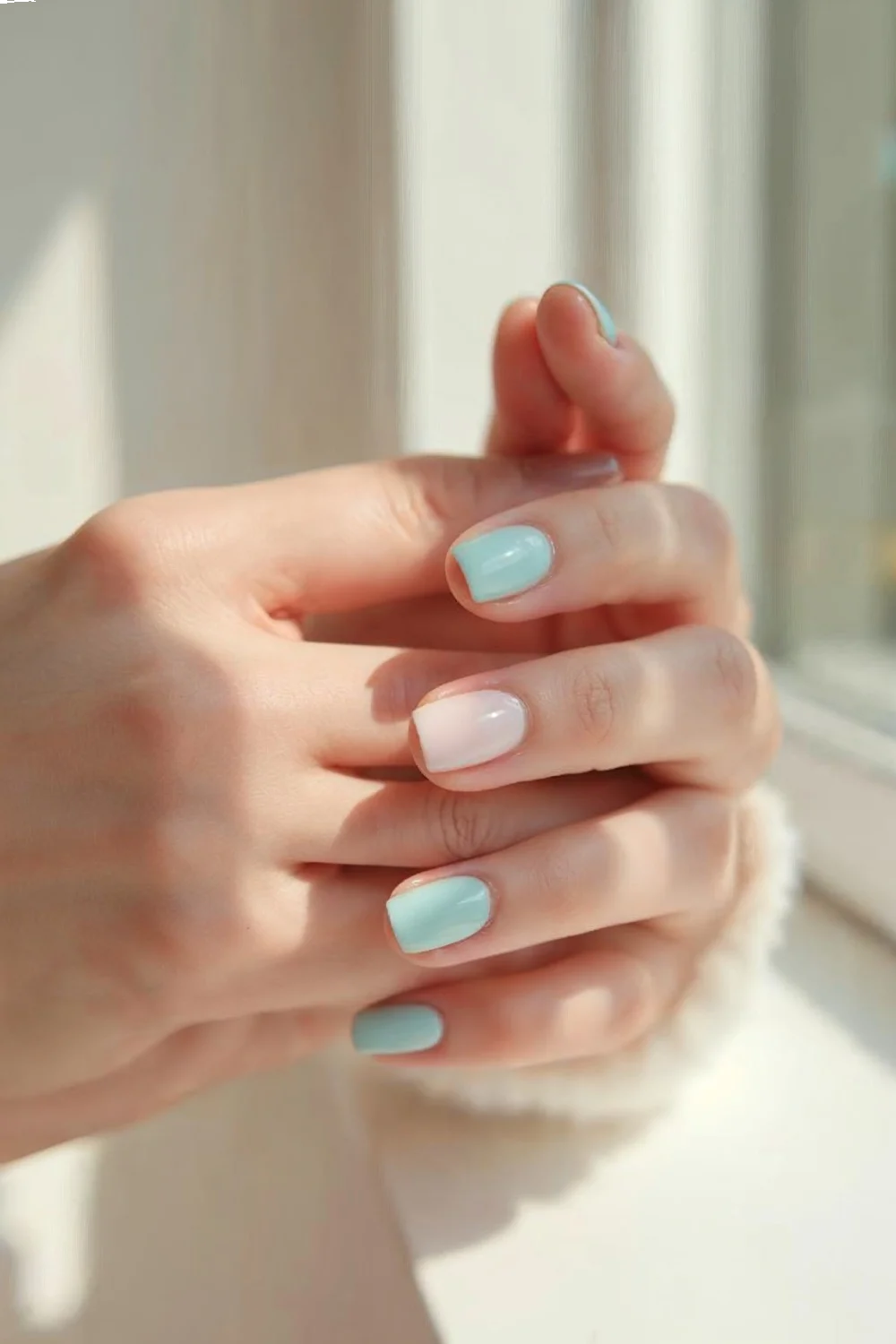 pastel blue and pink nails in glossy and matte finishes showcasing vacation nails design